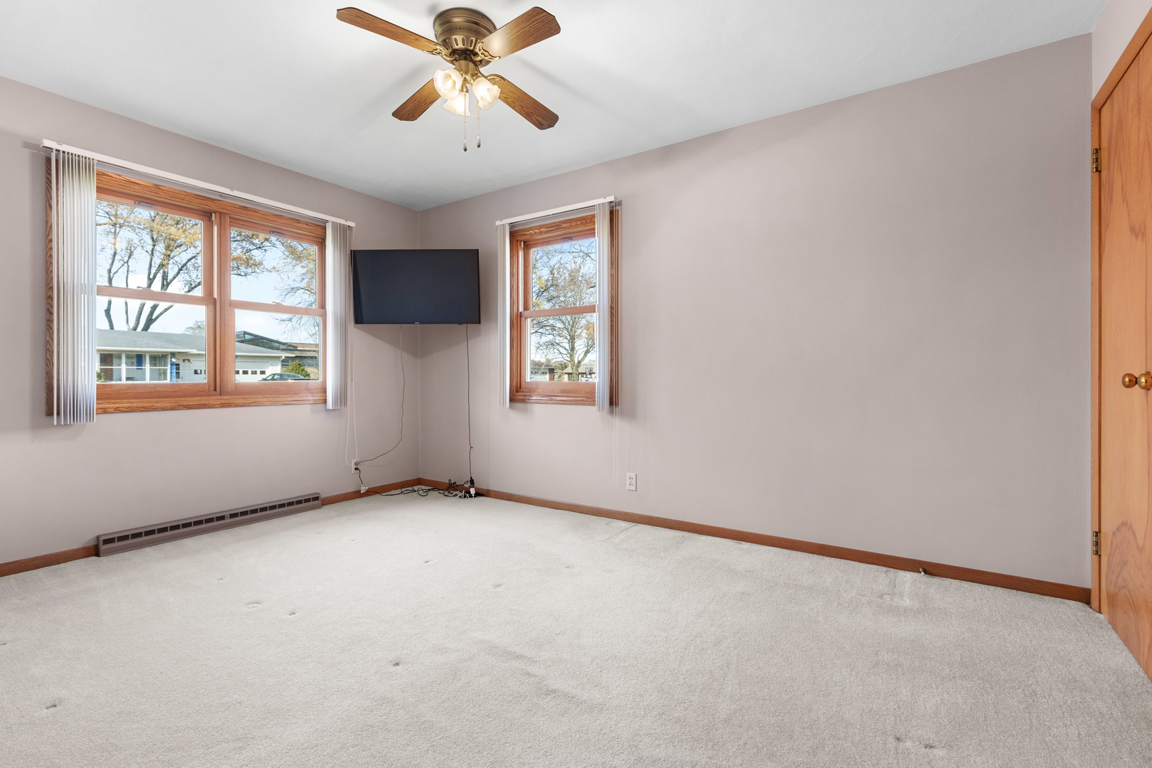 539 Riley Drive Marengo, IL 60152 - Photo 9 of 17 an empty room with windows and fan
