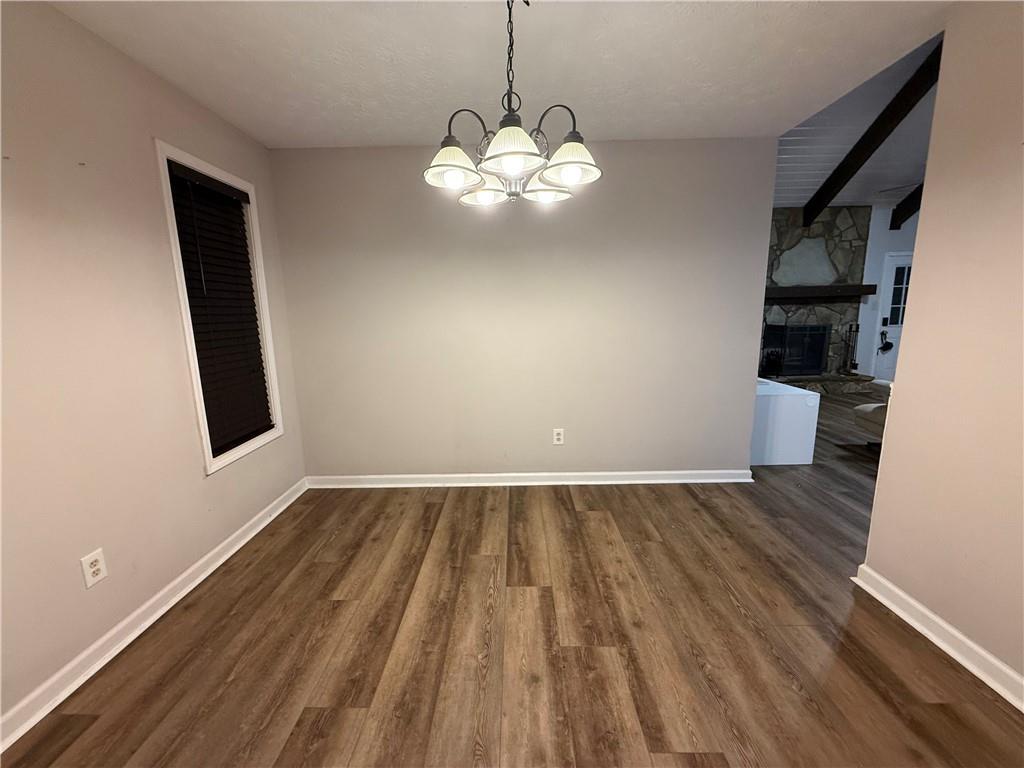 2400 Salem Drive Marietta, GA 30062 - Photo 14 of 16 wooden floor in an empty room with a window