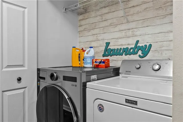 a utility room with dryer and washer