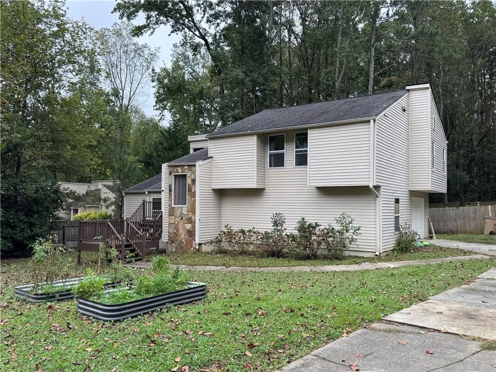 2400 Salem Drive Marietta, GA 30062 - Photo 2 of 16 a front view of a house with garden