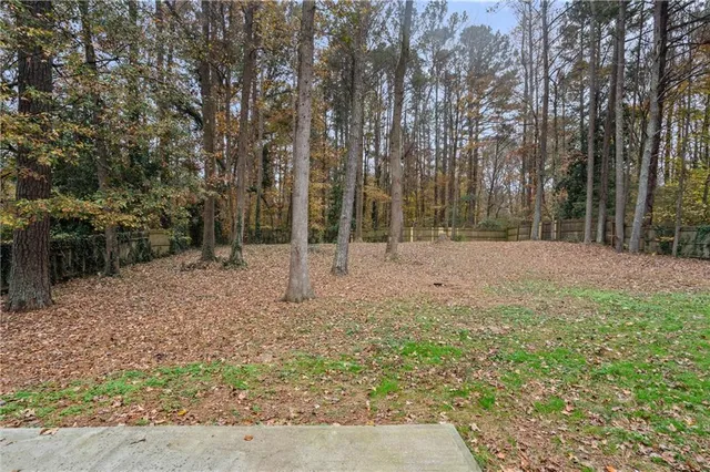 a backyard of a house with lots of green space