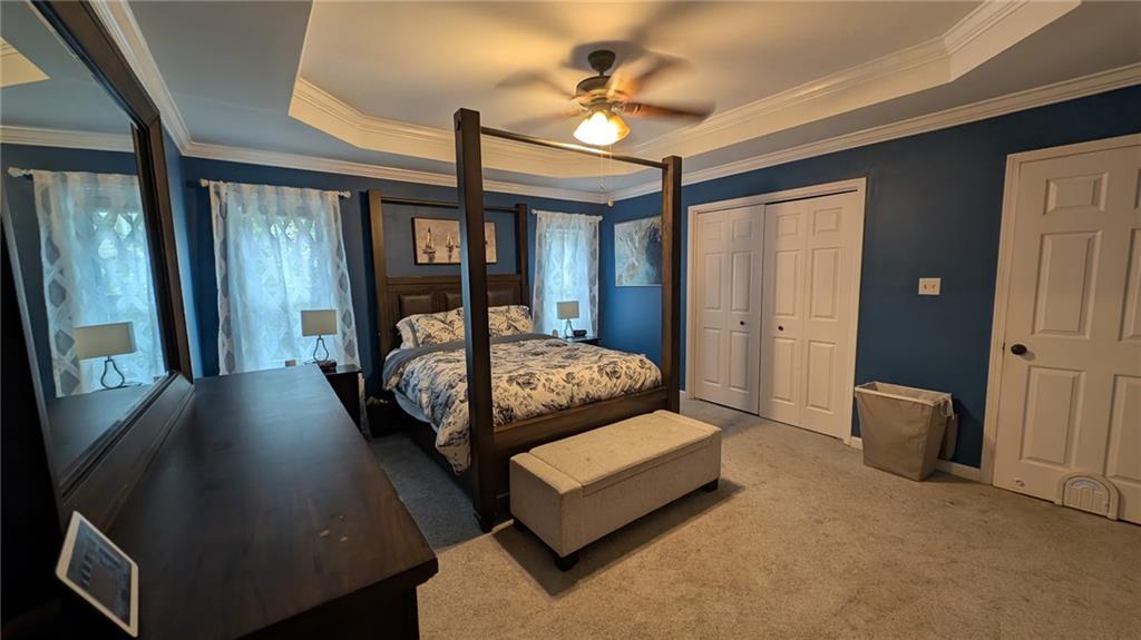 2400 Salem Drive Marietta, GA 30062 - Photo 8 of 16 a bed room with a bed and a chandelier