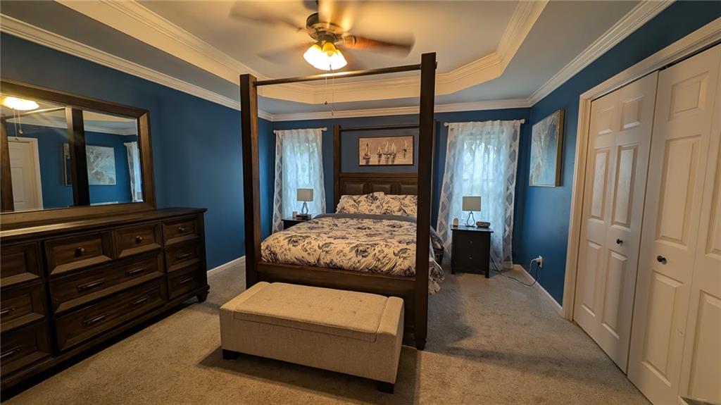 2400 Salem Drive Marietta, GA 30062 - Photo 9 of 16 a bedroom with a bed and a chandelier