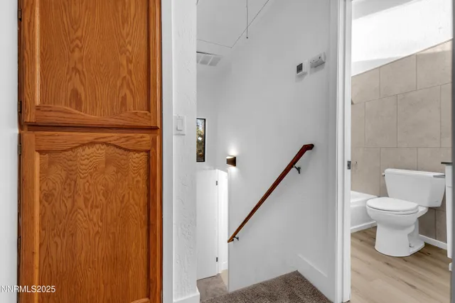 a bathroom with a toilet and a sink
