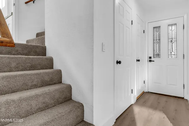 a living room with furniture and white walls
