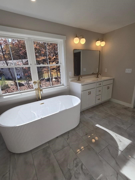 Lot 9 Willard Road Ashburnham, MA 01430 - Photo 17 of 24 a spacious bathroom with a tub sink and mirror