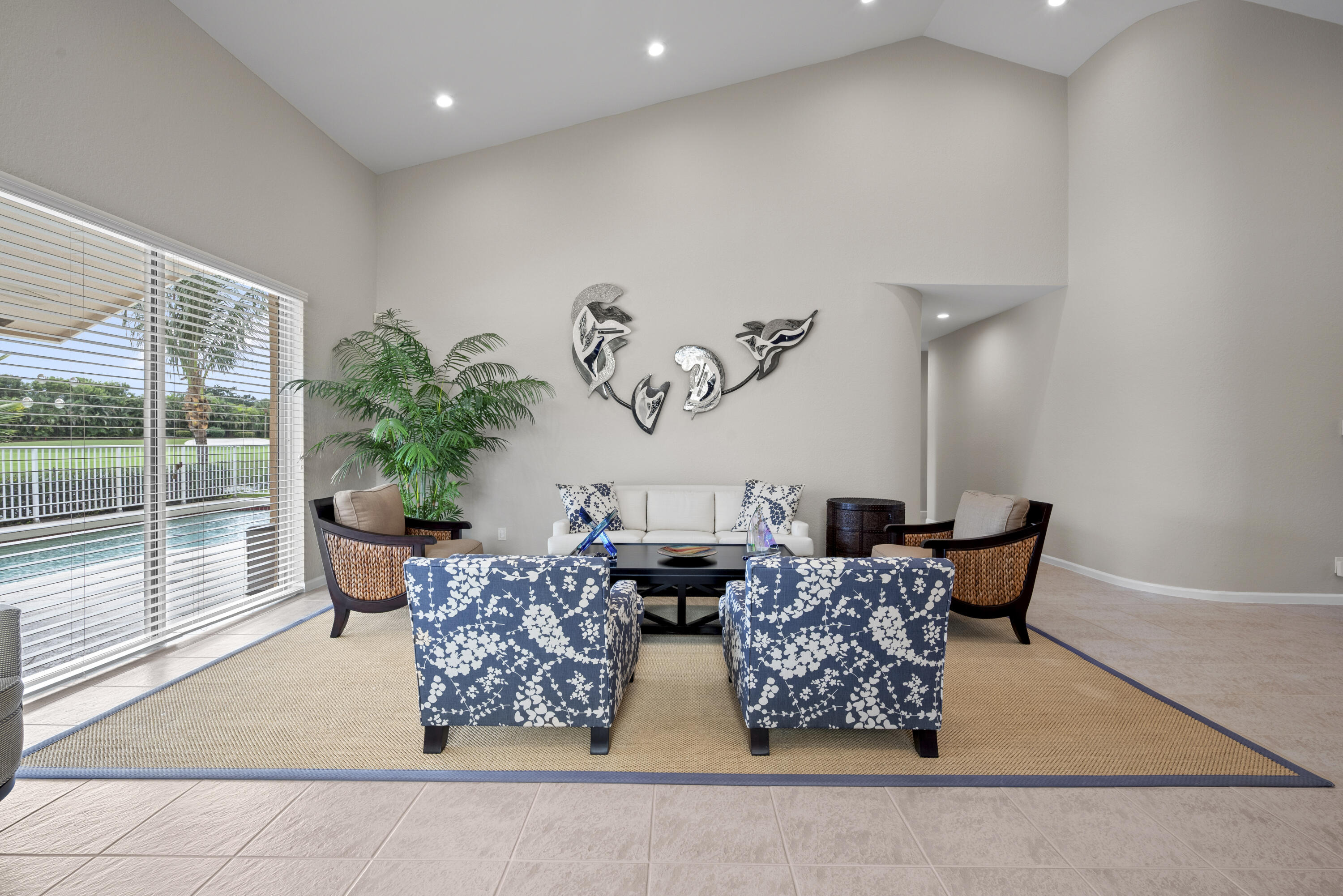 10670 Stonebridge Boulevard Boca Raton, FL 33498 - Photo 12 of 58 a living room with furniture and a large window