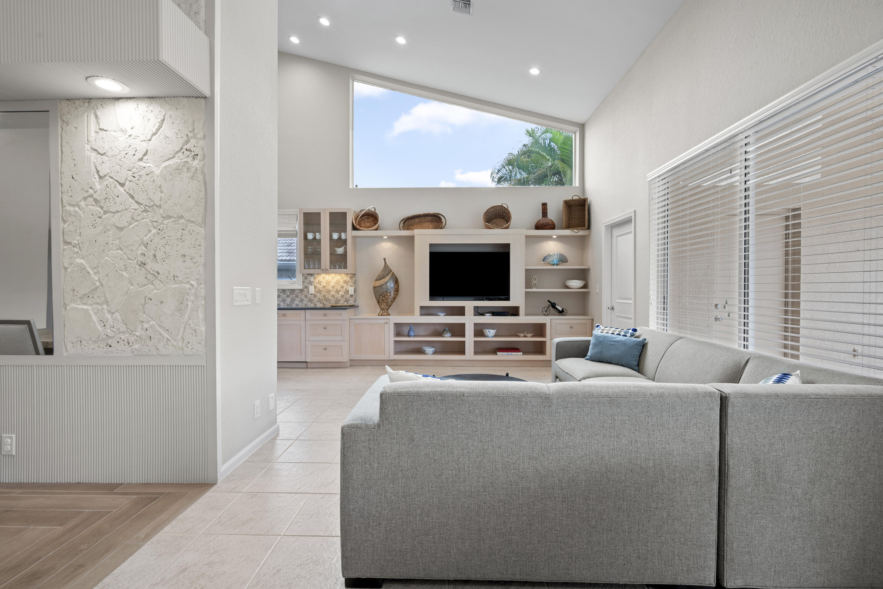 10670 Stonebridge Boulevard Boca Raton, FL 33498 - Photo 16 of 58 a living room with furniture and a flat screen tv
