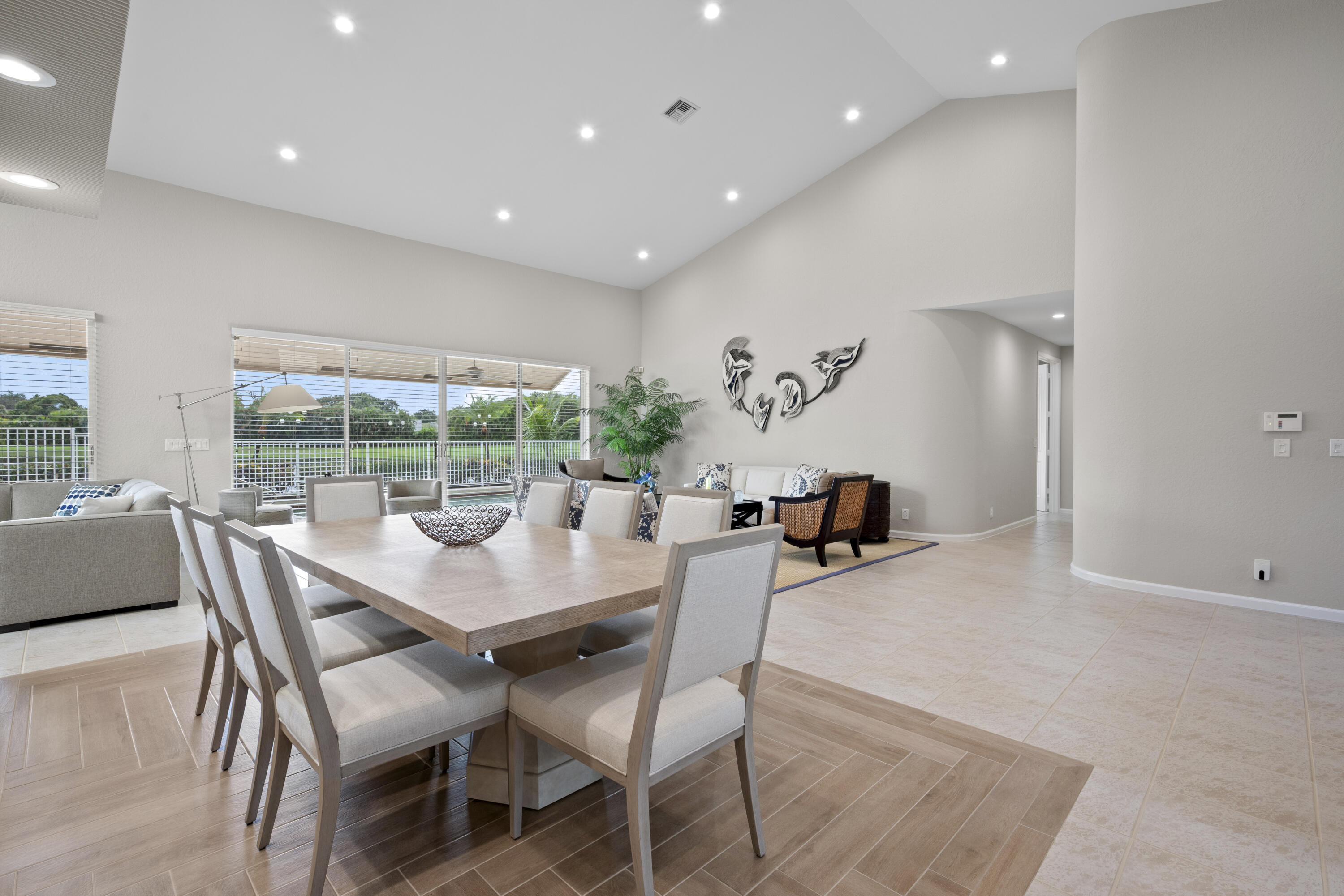 10670 Stonebridge Boulevard Boca Raton, FL 33498 - Photo 20 of 58 a dining room with furniture and wooden floor