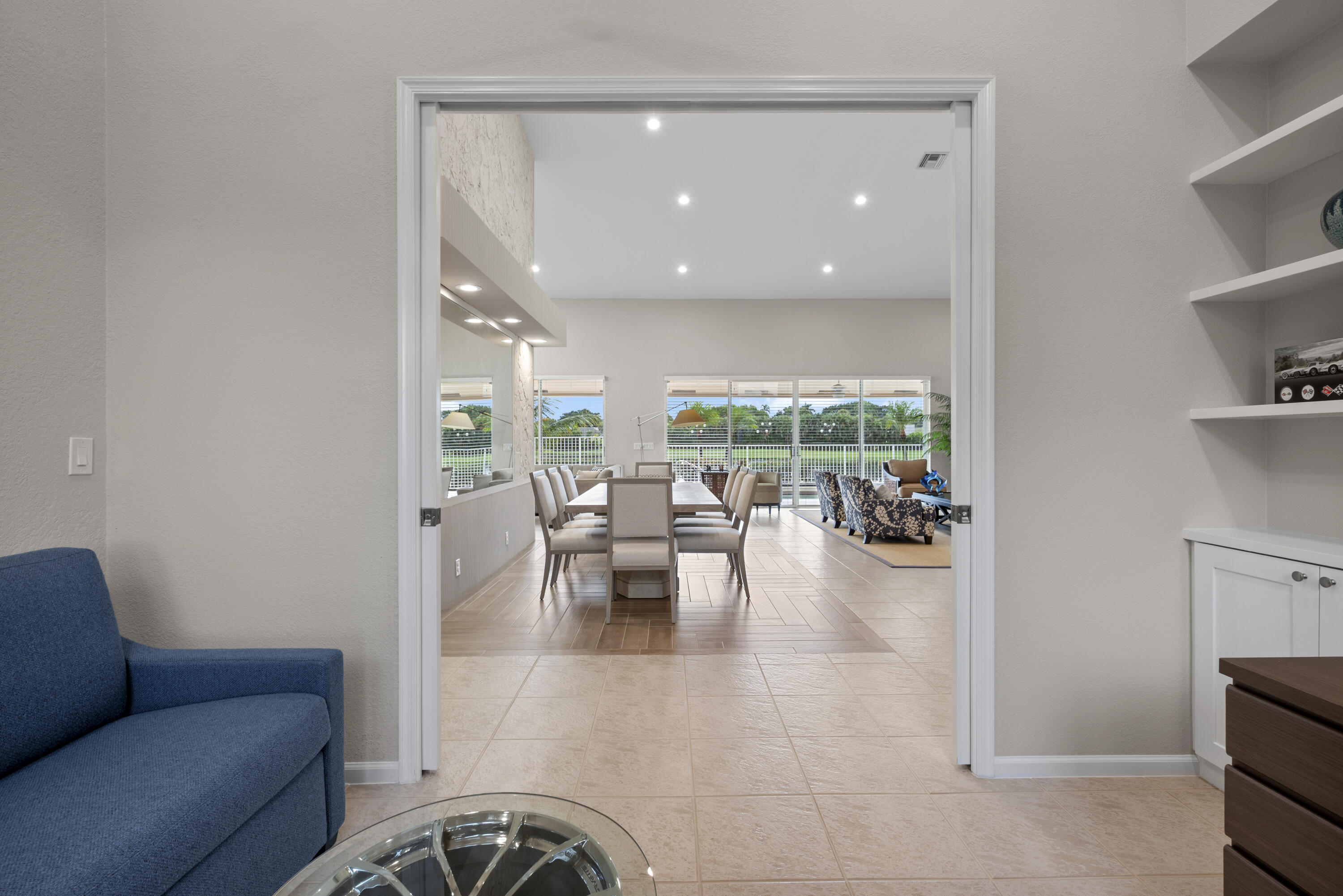 10670 Stonebridge Boulevard Boca Raton, FL 33498 - Photo 23 of 58 a living room with furniture and a large window