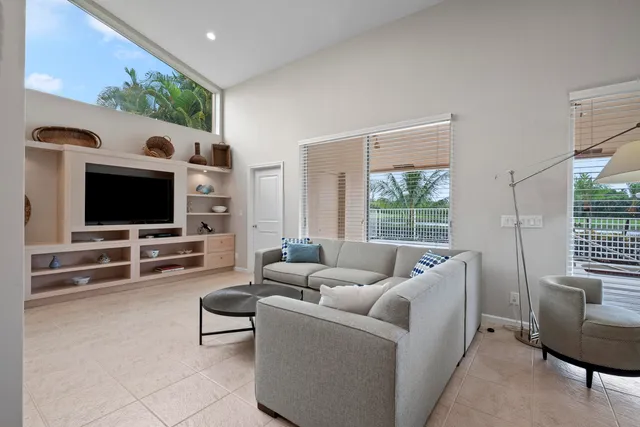 a large white kitchen with lots of counter space and appliances