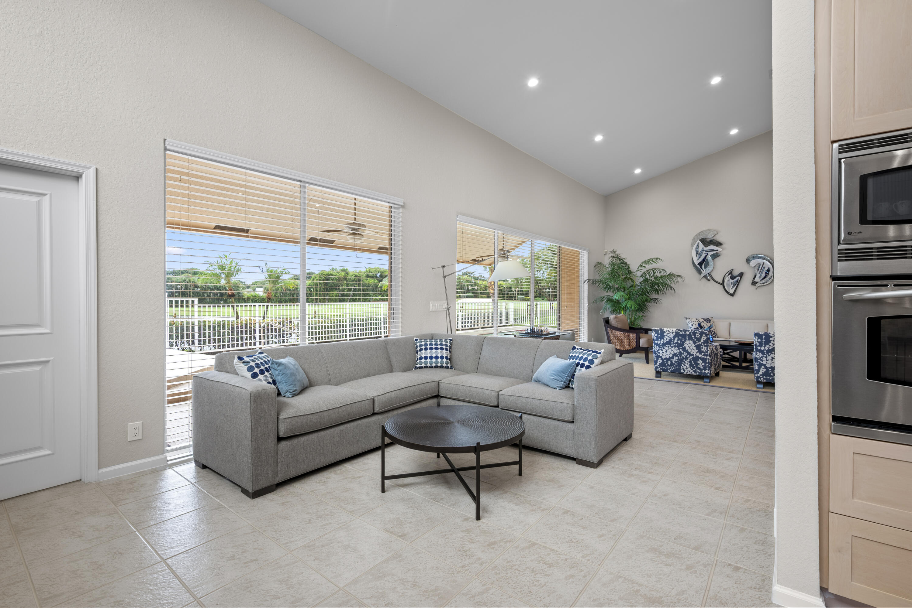10670 Stonebridge Boulevard Boca Raton, FL 33498 - Photo 26 of 58 a living room with furniture and a large window