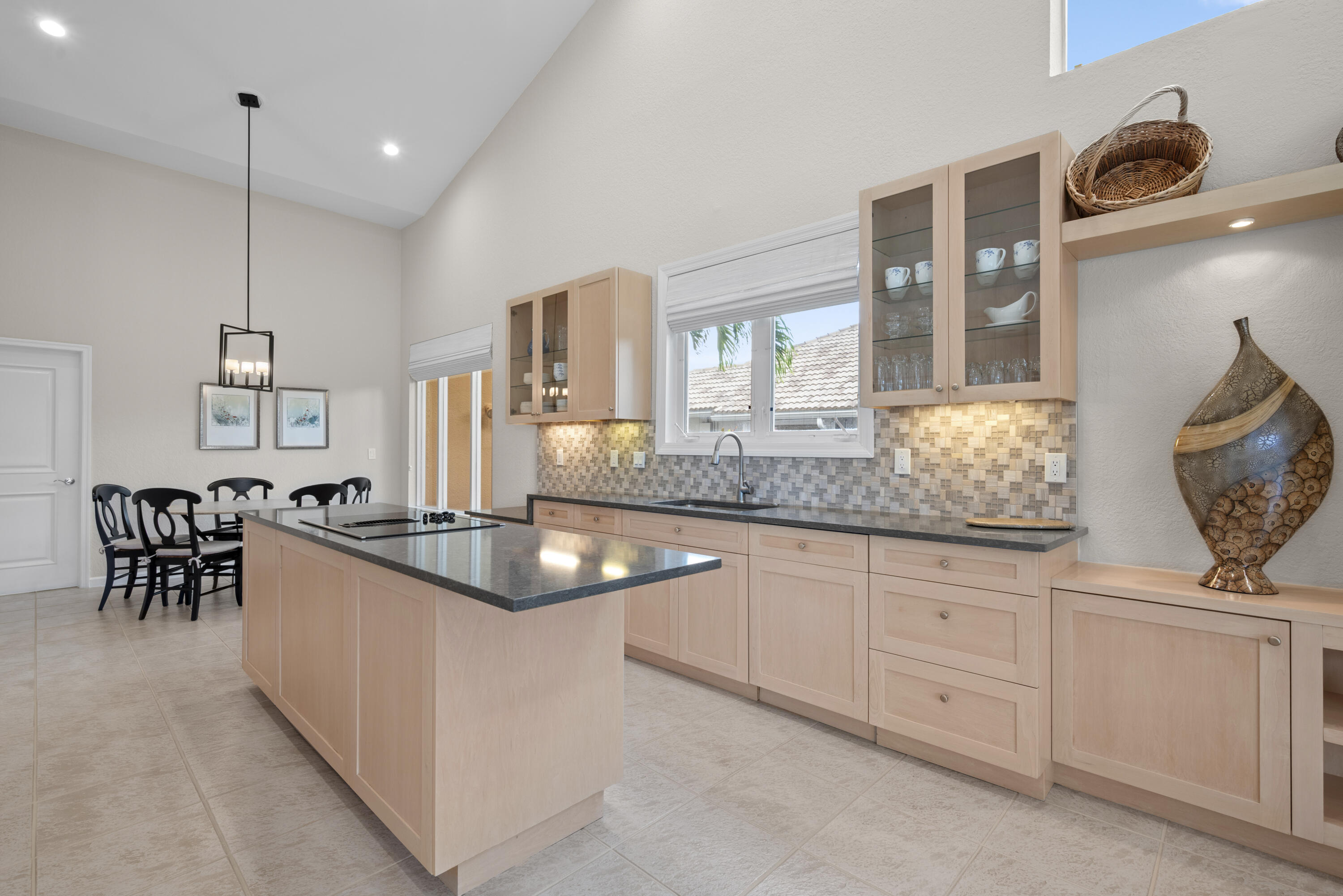 10670 Stonebridge Boulevard Boca Raton, FL 33498 - Photo 30 of 58 a kitchen with sink and cabinets
