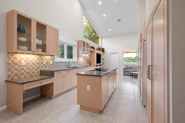 a view of a a dining room with furniture window and wooden floor