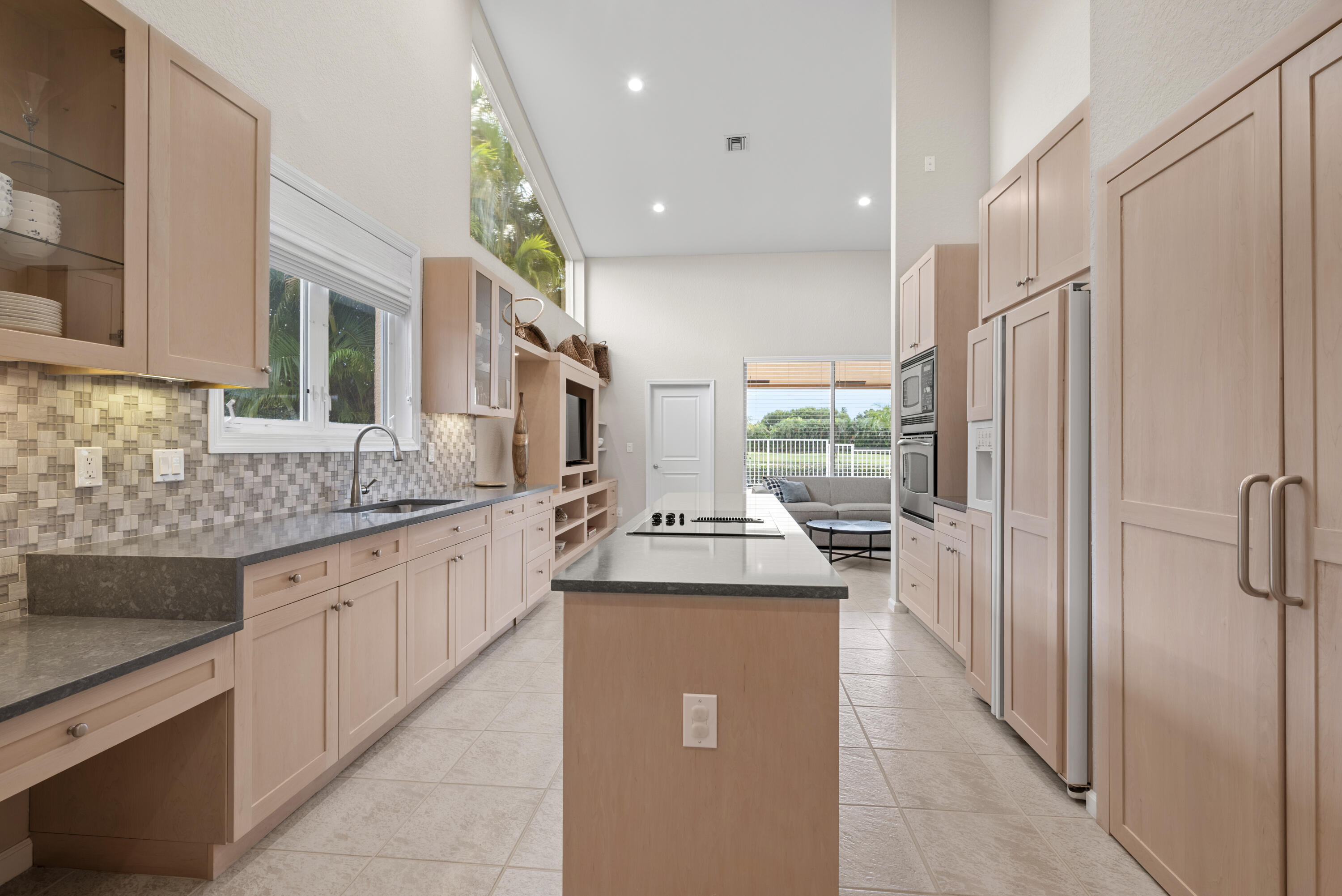10670 Stonebridge Boulevard Boca Raton, FL 33498 - Photo 33 of 58 a kitchen with stainless steel appliances granite countertop a sink and a refrigerator