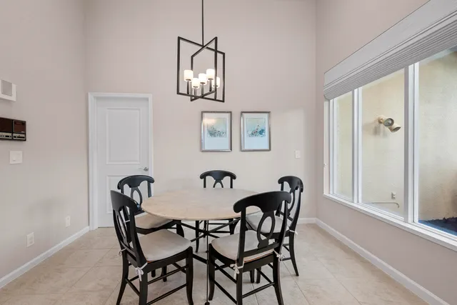 a spacious bedroom with a bed and a window