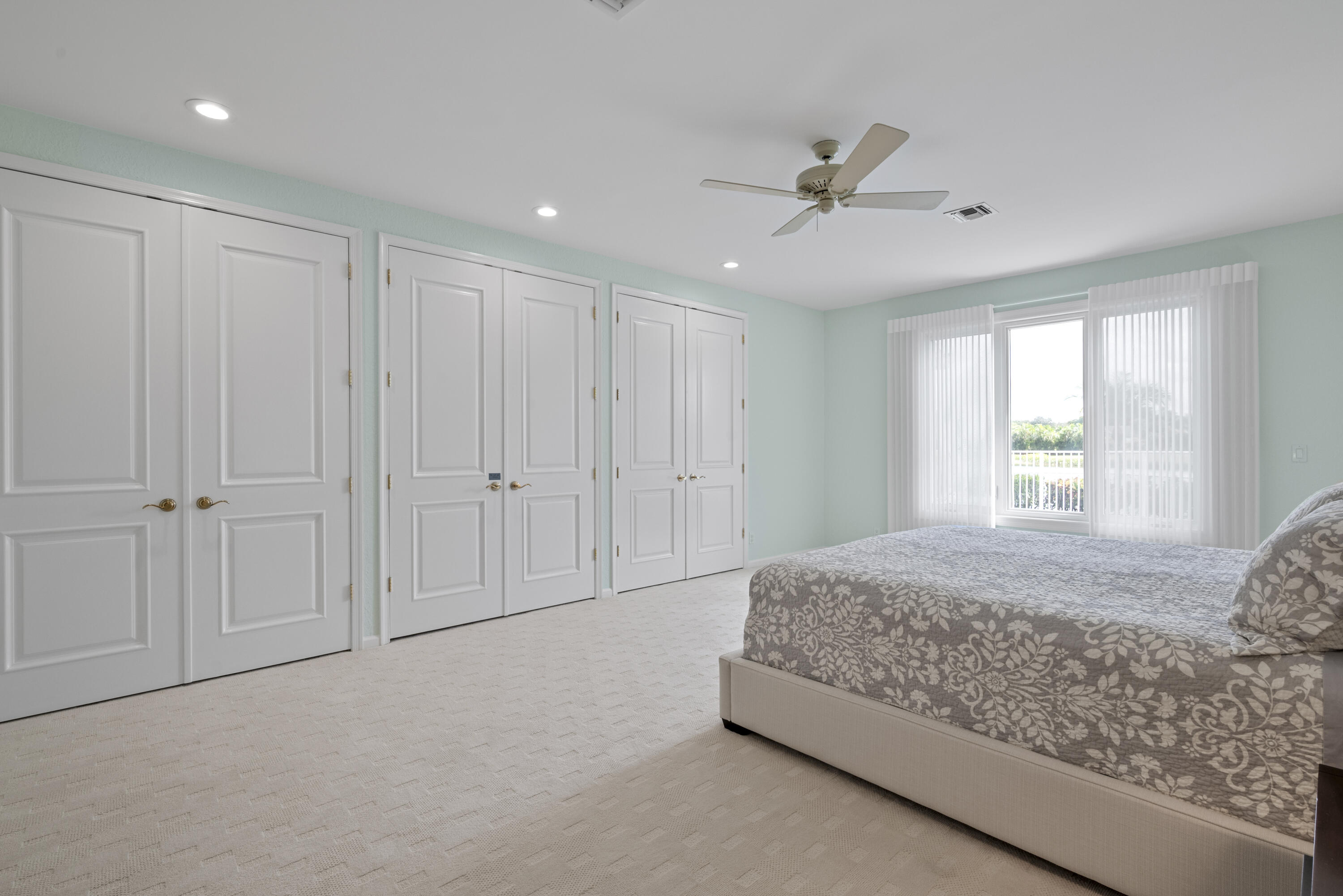 10670 Stonebridge Boulevard Boca Raton, FL 33498 - Photo 38 of 58 a spacious bedroom with a bed and a window