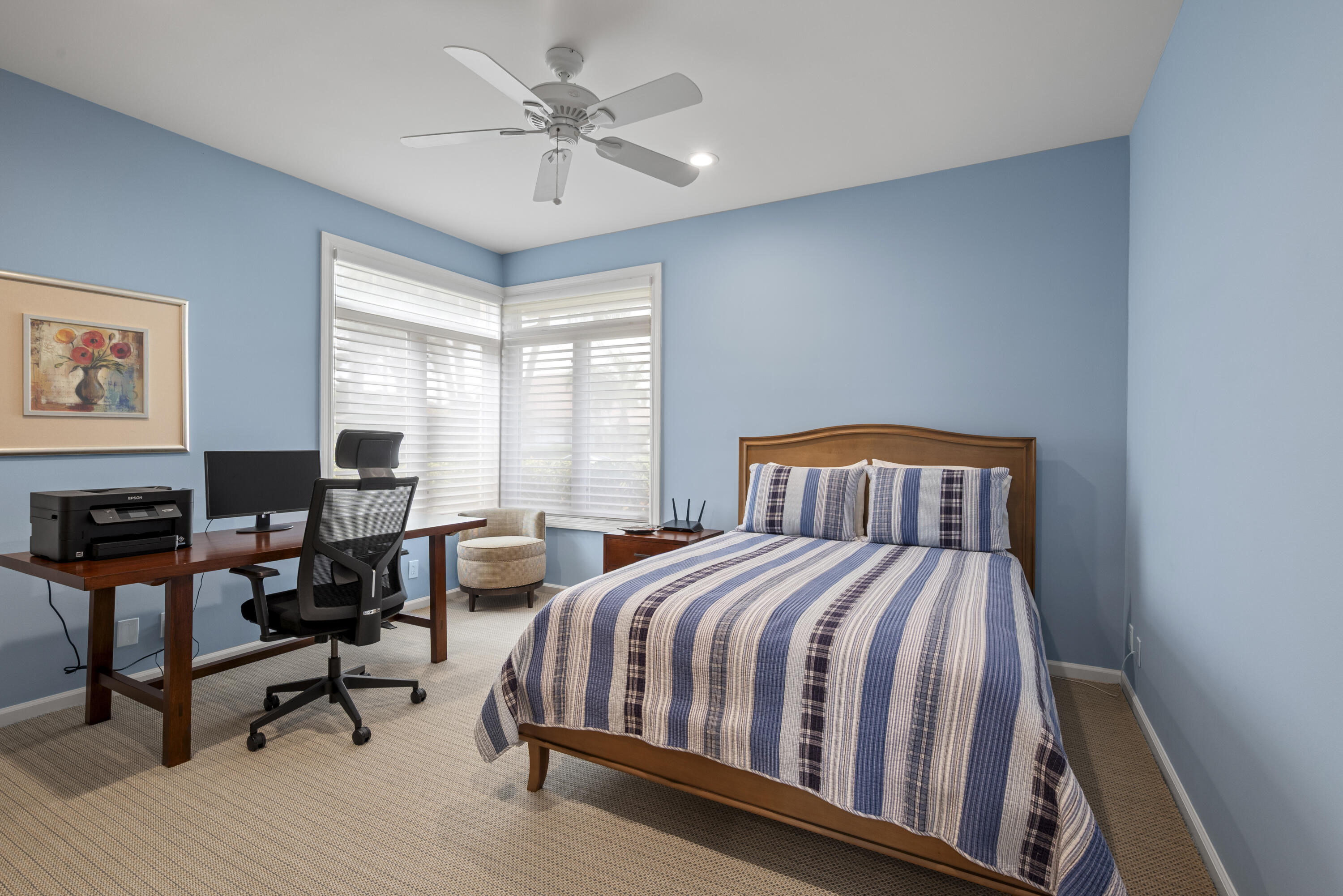 10670 Stonebridge Boulevard Boca Raton, FL 33498 - Photo 39 of 58 a bedroom with a bed a chair and a large window