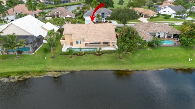 a living room with furniture a flat screen tv and a large window
