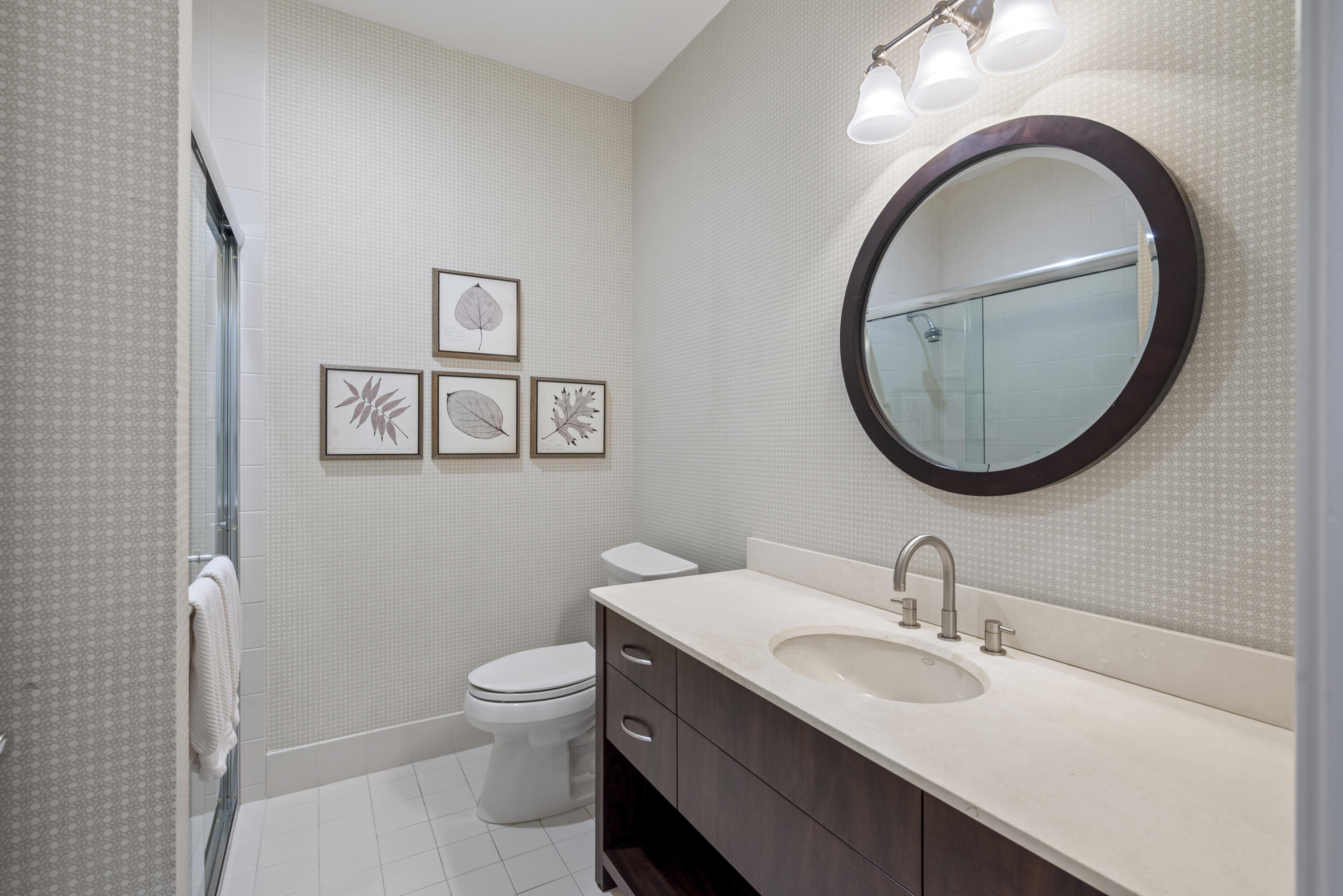 10670 Stonebridge Boulevard Boca Raton, FL 33498 - Photo 42 of 58 a bathroom with a toilet a sink and a mirror