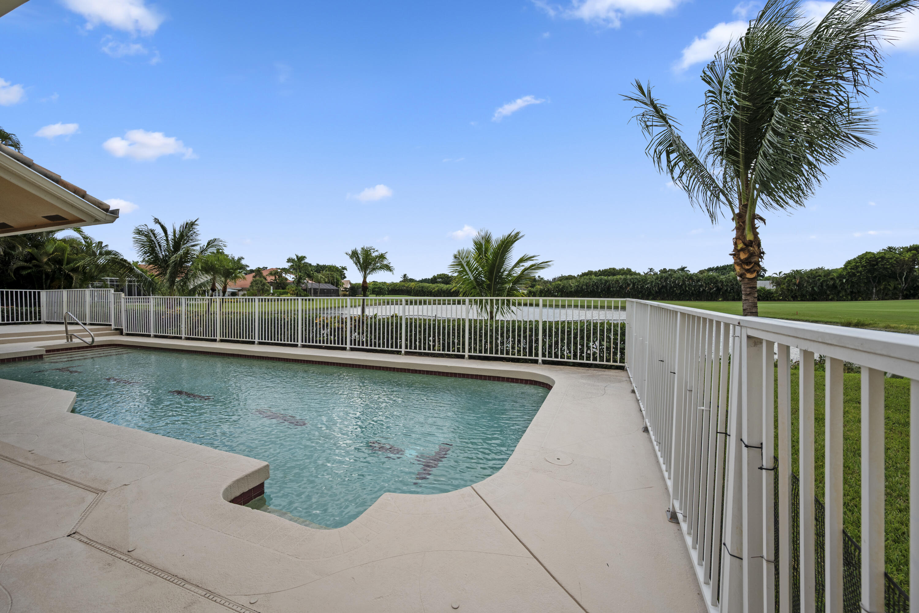 10670 Stonebridge Boulevard Boca Raton, FL 33498 - Photo 50 of 58 a view of a backyard with a lake view