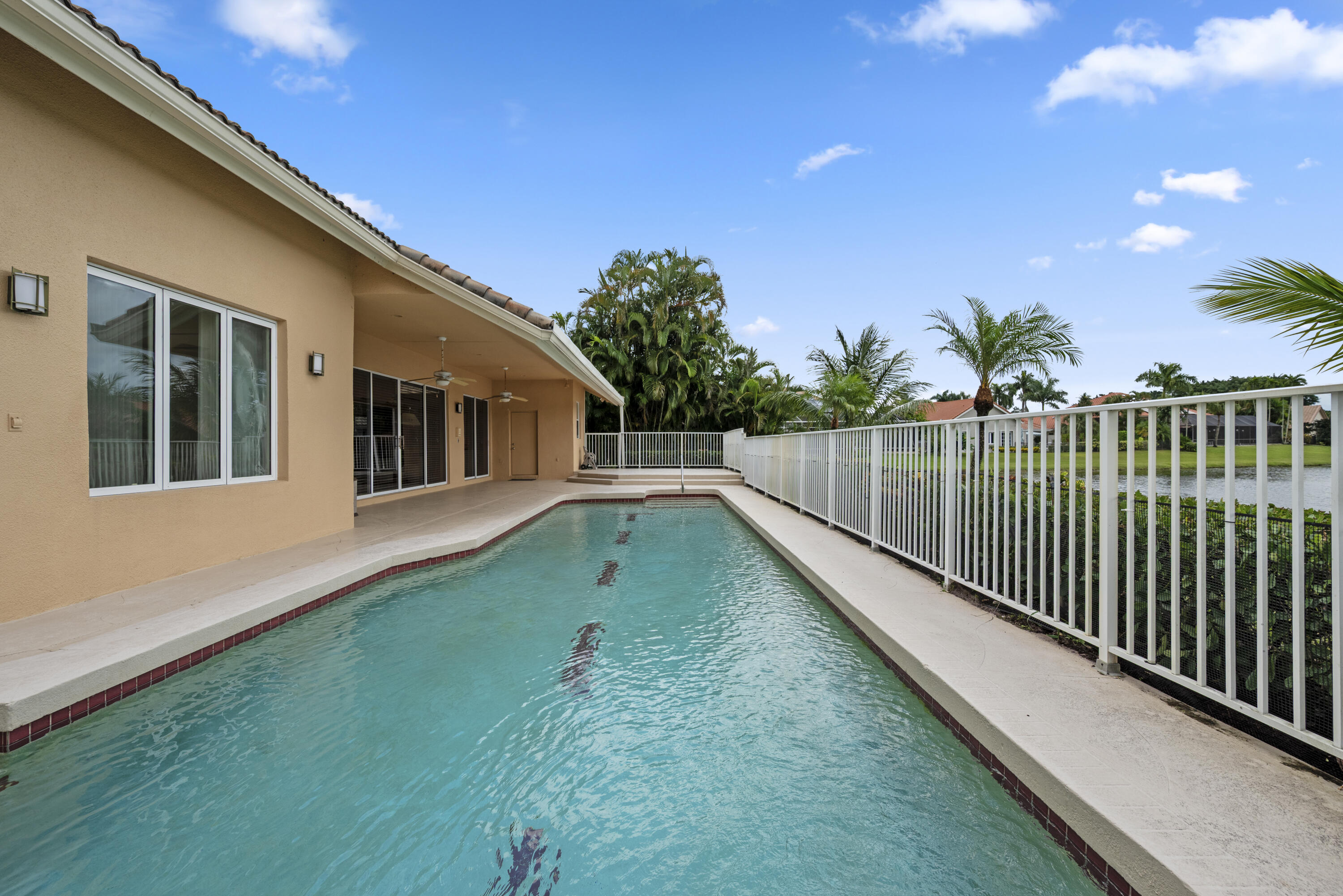 10670 Stonebridge Boulevard Boca Raton, FL 33498 - Photo 52 of 58 a view of swimming pool with a backyard