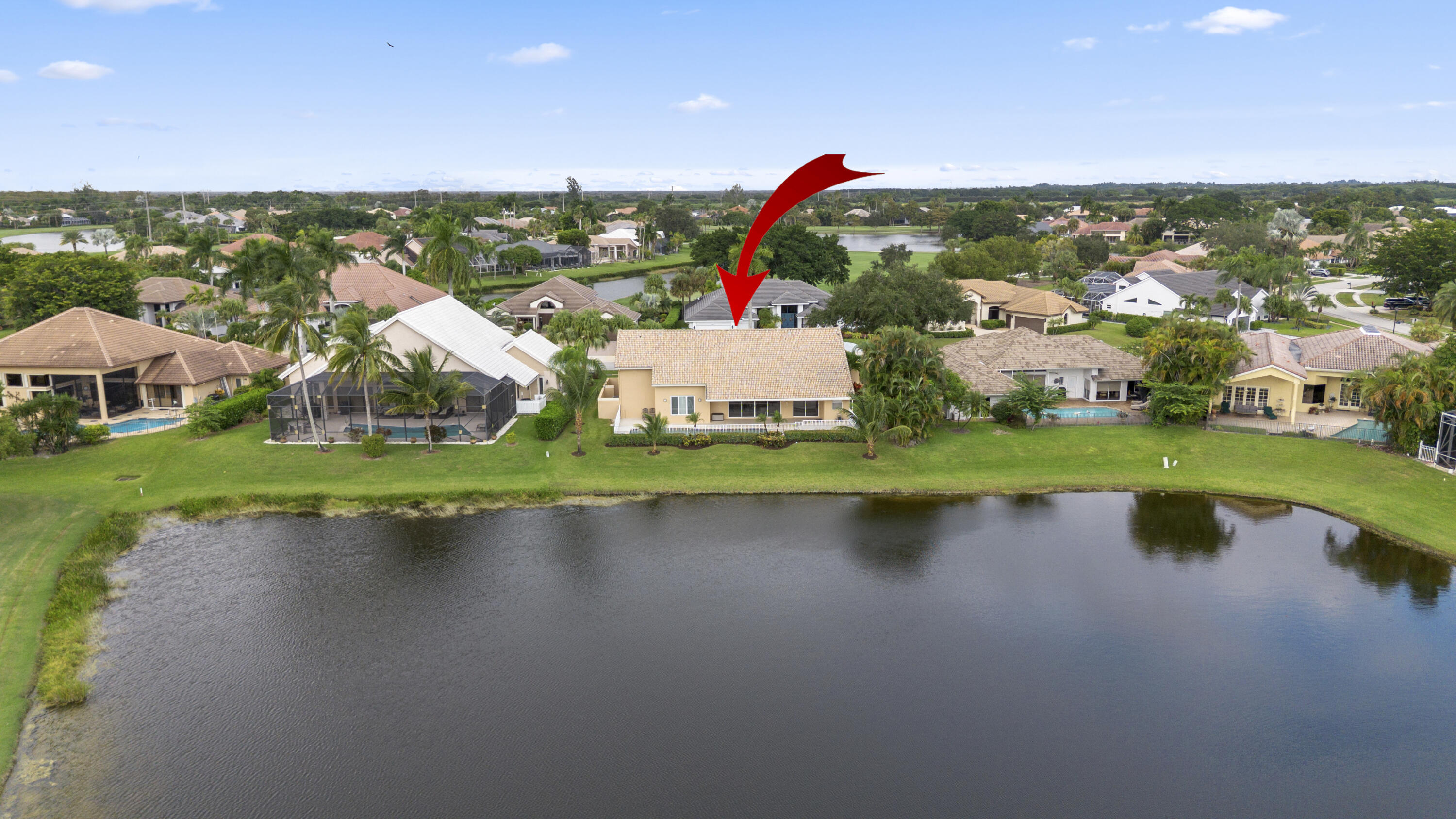 10670 Stonebridge Boulevard Boca Raton, FL 33498 - Photo 58 of 58 a view of a lake with houses on the side