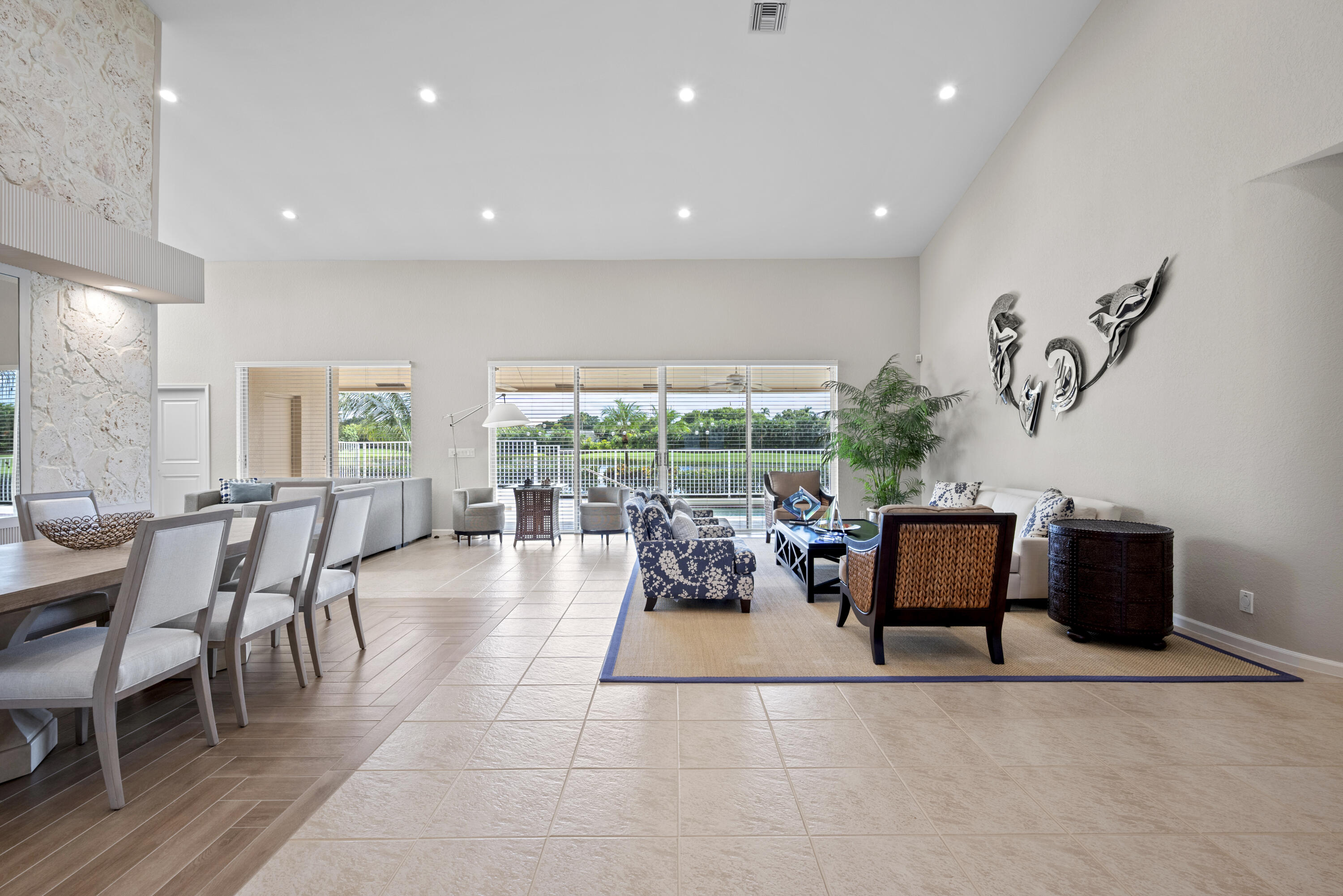 10670 Stonebridge Boulevard Boca Raton, FL 33498 - Photo 7 of 58 a living room with furniture a flat screen tv and a large window