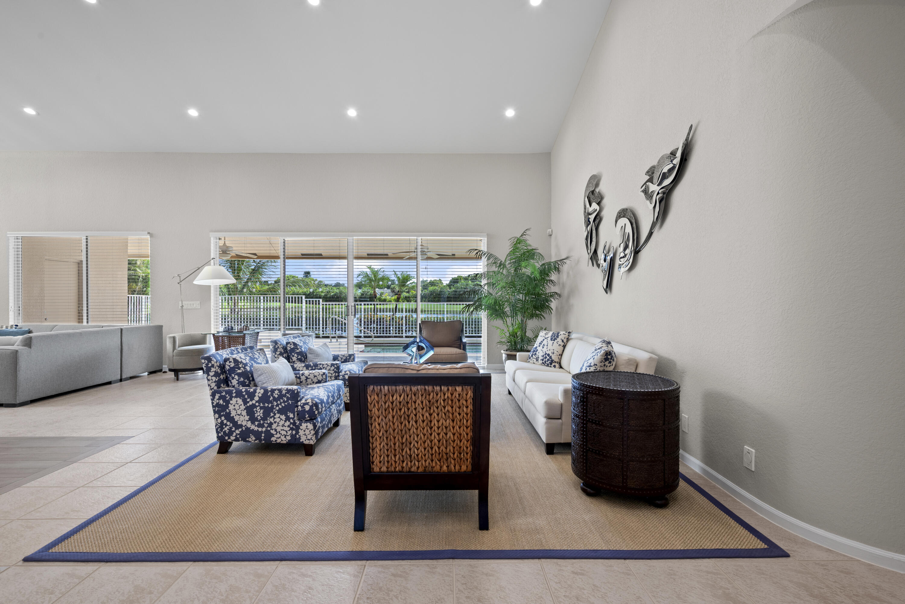 10670 Stonebridge Boulevard Boca Raton, FL 33498 - Photo 8 of 58 a living room with furniture and a large window
