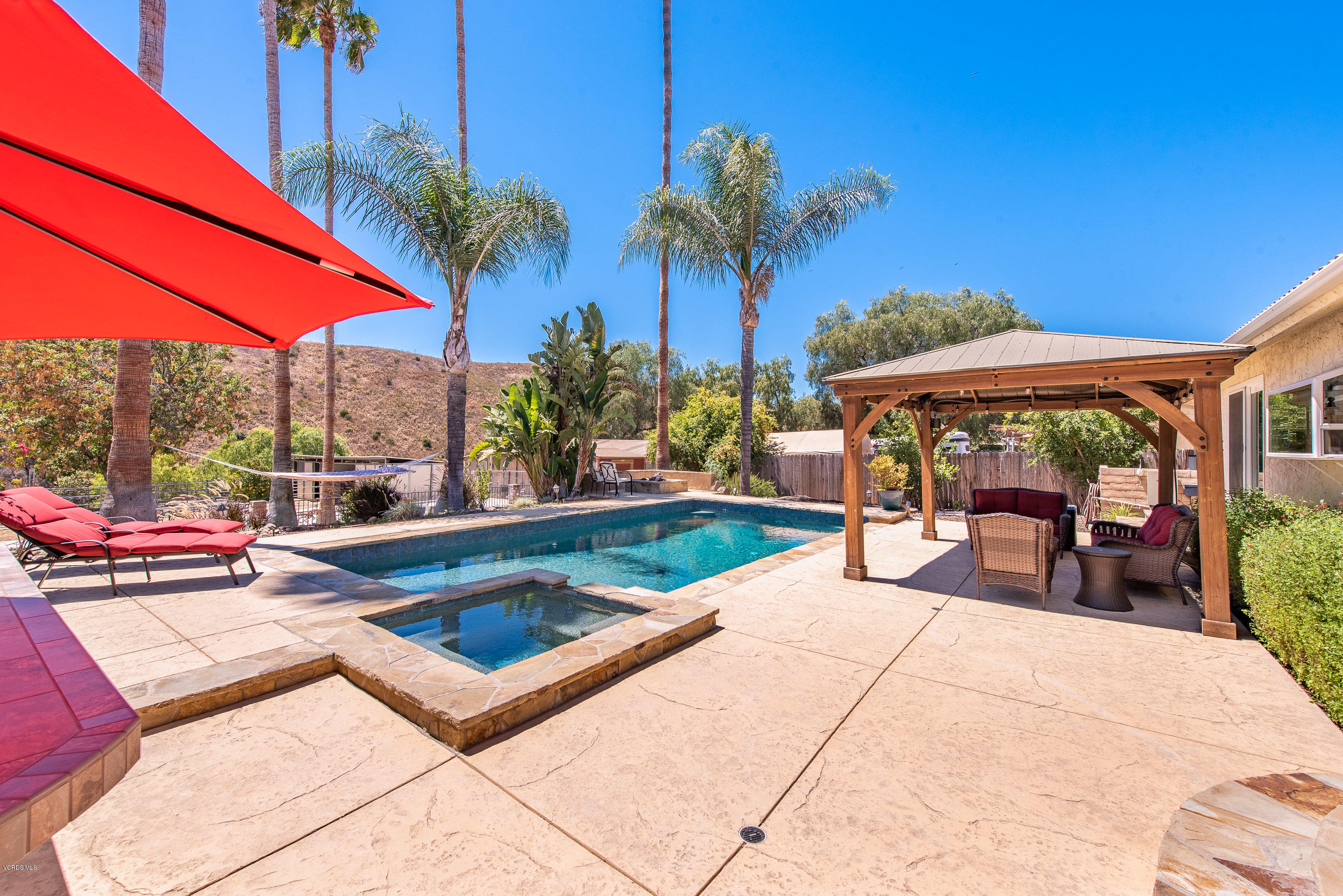 1242 Rambling Road Simi Valley, CA 93065 - Photo 2 of 81 a view of swimming pool with chairs and tables