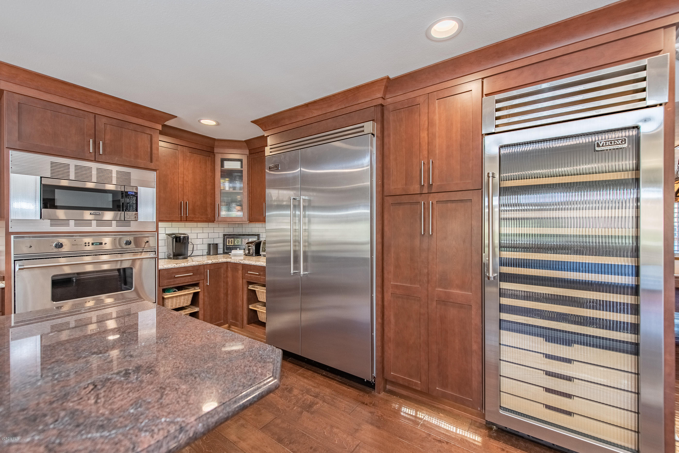1242 Rambling Road Simi Valley, CA 93065 - Photo 15 of 81 a kitchen with stainless steel appliances granite countertop a refrigerator and a stove top oven