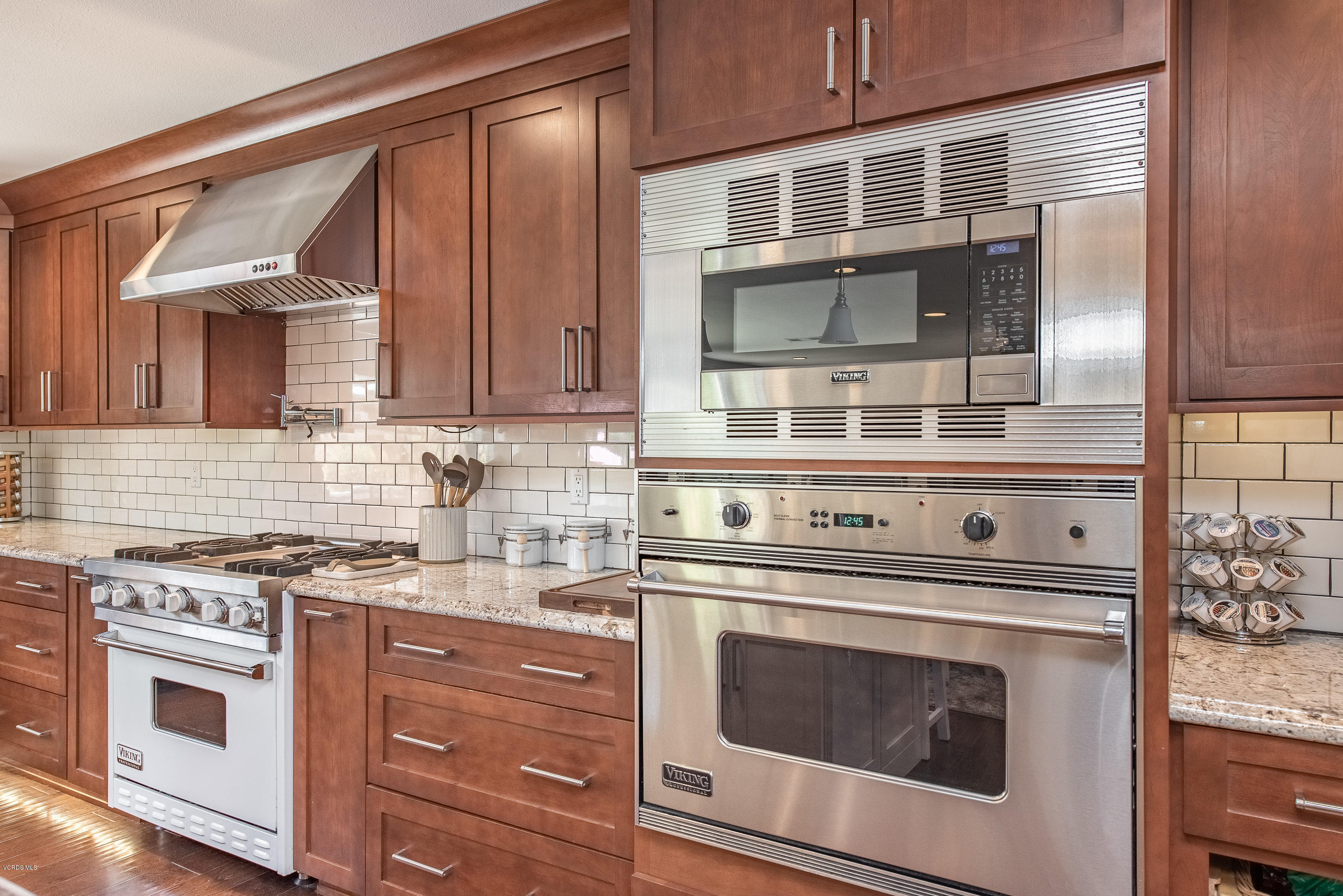 1242 Rambling Road Simi Valley, CA 93065 - Photo 16 of 81 a kitchen with stainless steel appliances granite countertop a stove and a microwave