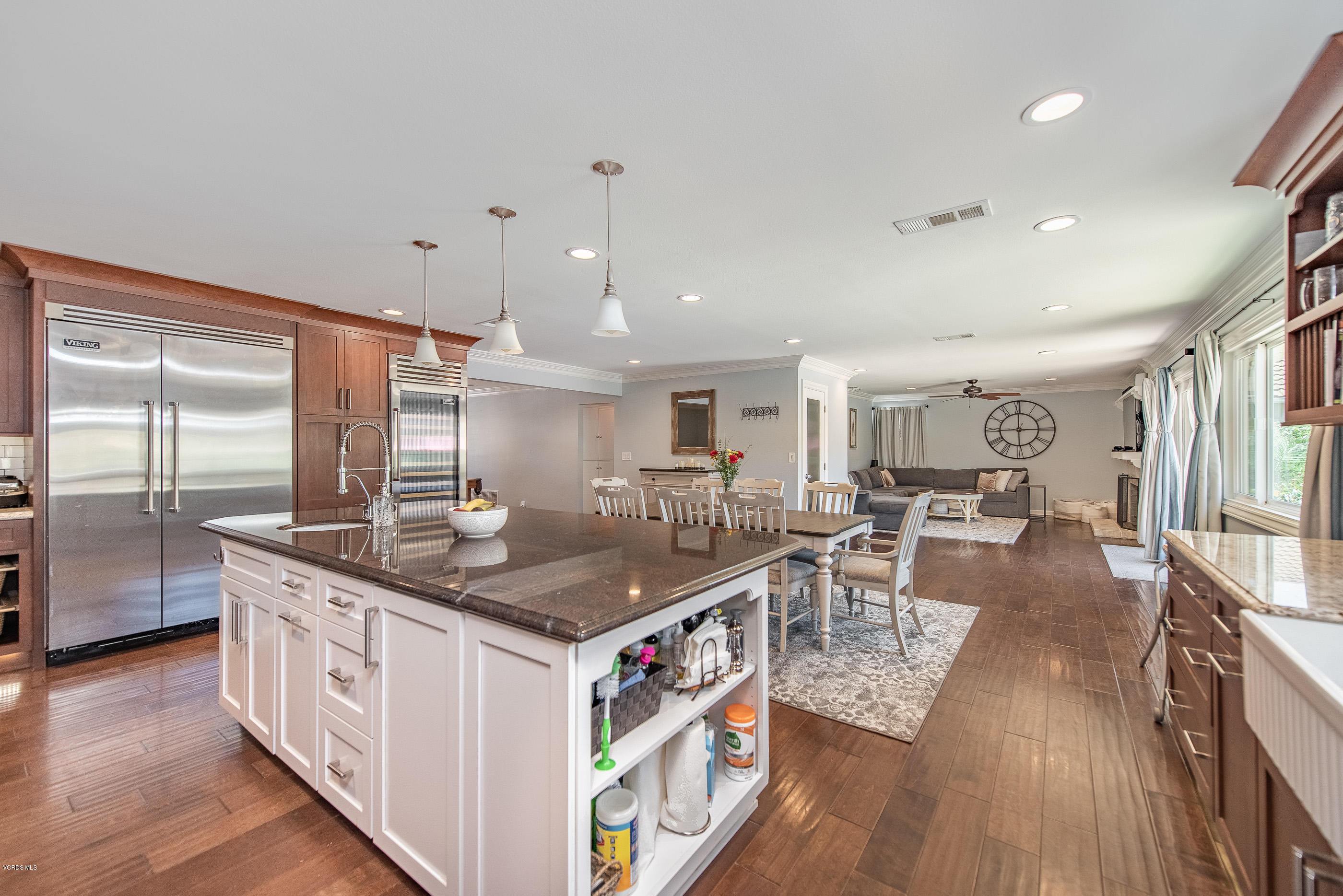 1242 Rambling Road Simi Valley, CA 93065 - Photo 17 of 81 a kitchen with counter top space and wooden floor