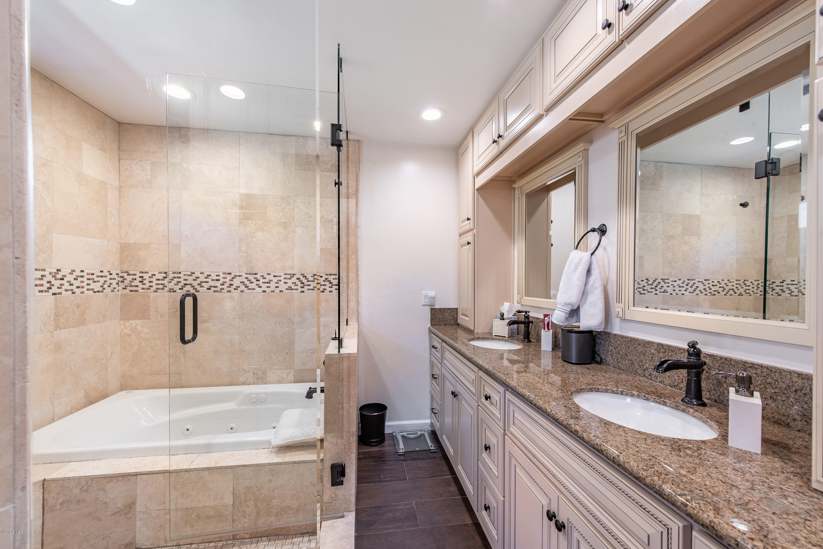 1242 Rambling Road Simi Valley, CA 93065 - Photo 32 of 81 a bathroom with a granite countertop tub sink and mirror