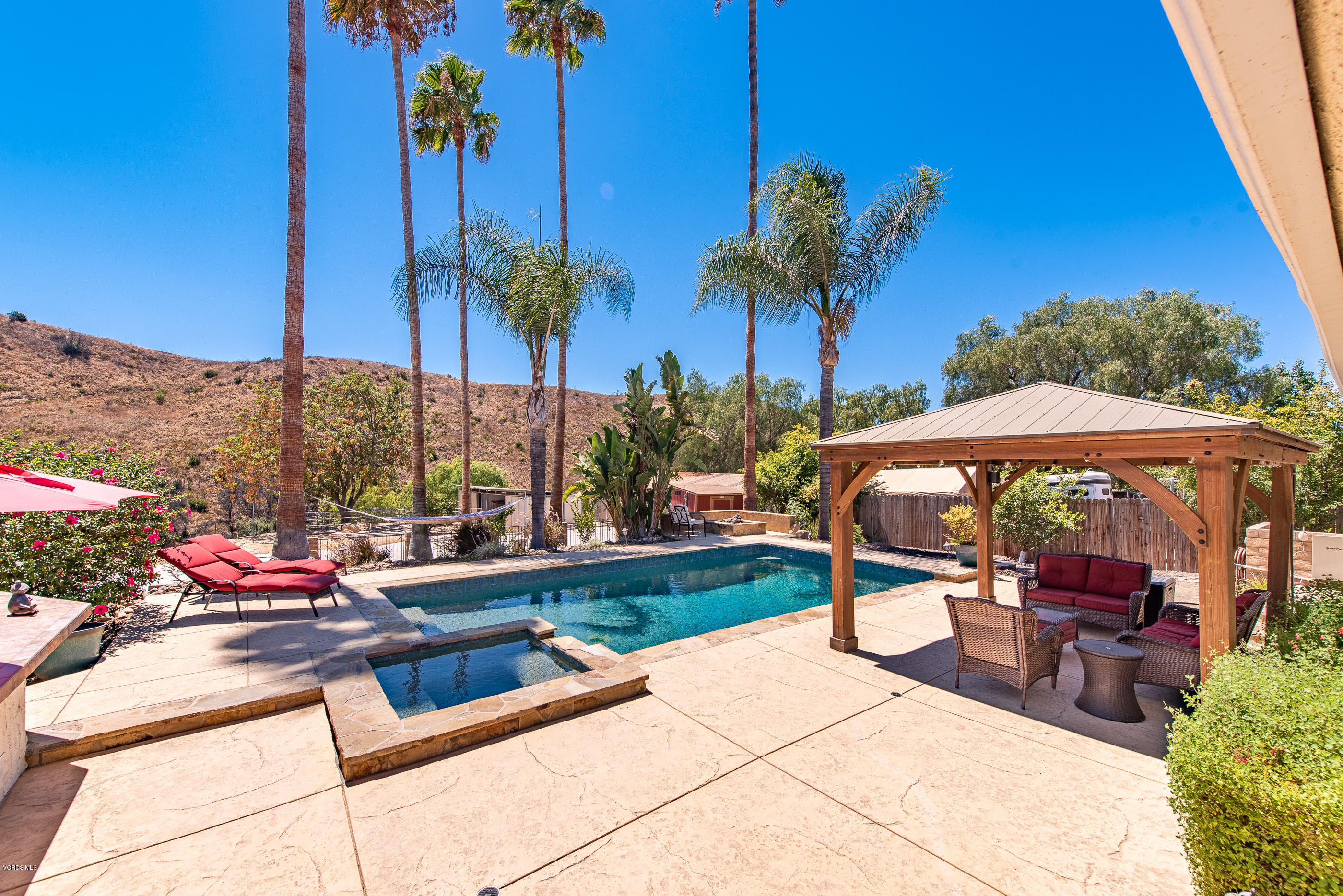 1242 Rambling Road Simi Valley, CA 93065 - Photo 41 of 81 a view of an outdoor sitting area with swimming pool