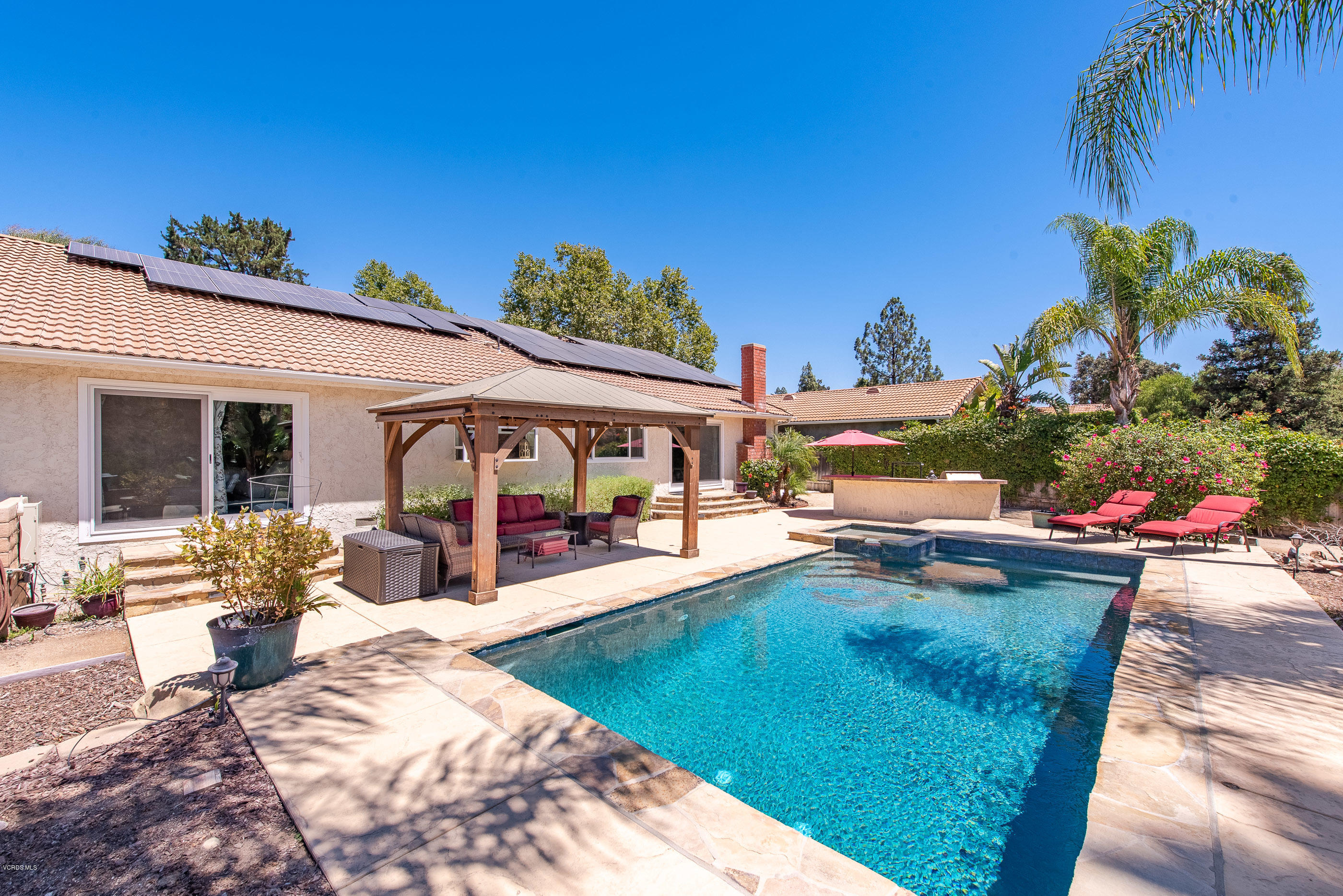 1242 Rambling Road Simi Valley, CA 93065 - Photo 45 of 81 a view of a house with swimming pool and sitting area