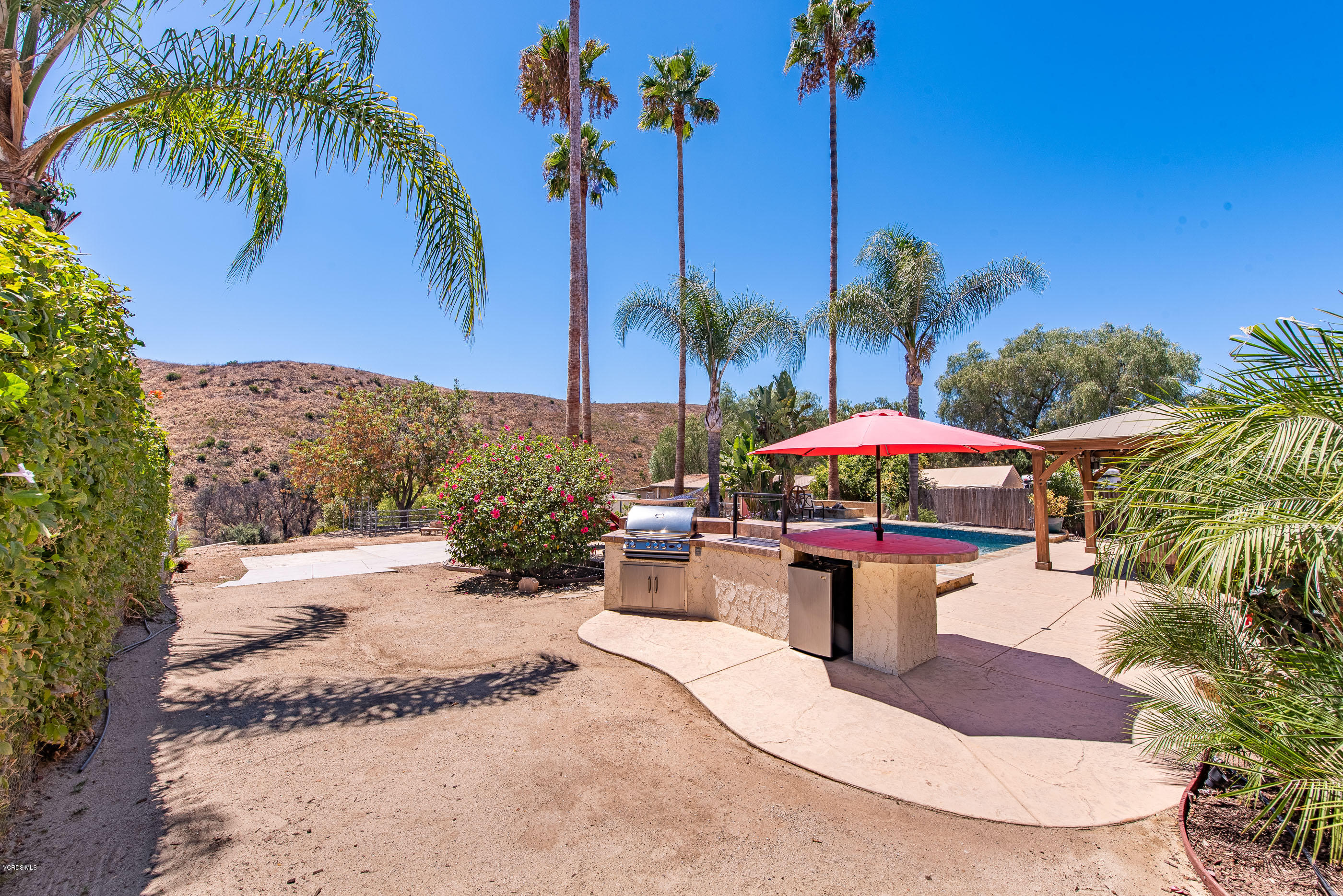 1242 Rambling Road Simi Valley, CA 93065 - Photo 58 of 81 a view of a backyard with swimming pool