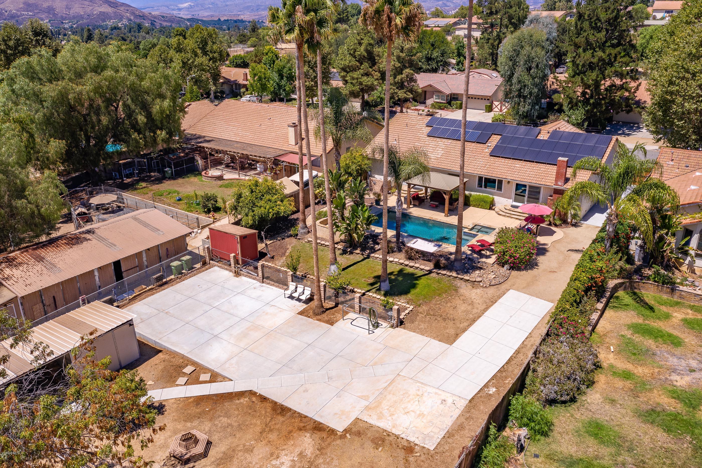 1242 Rambling Road Simi Valley, CA 93065 - Photo 66 of 81 an aerial view of a house with a garden and lake view