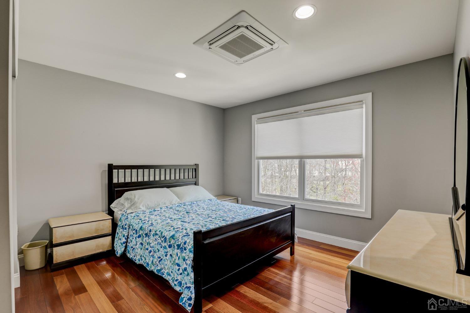 33 Edinburg Circle Old Bridge, NJ 07747 - Photo 27 of 51 a bedroom with a bed and wooden floor
