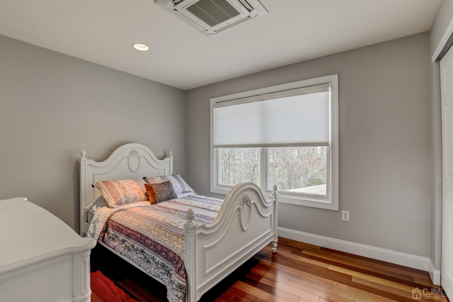 33 Edinburg Circle Old Bridge, NJ 07747 - Photo 30 of 51 a bed sitting in a bedroom next to a window