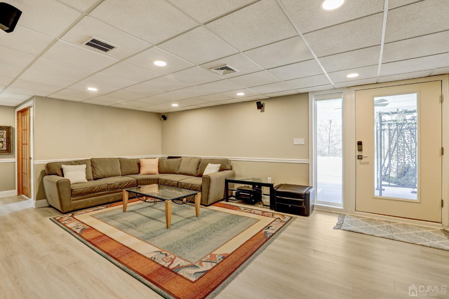 33 Edinburg Circle Old Bridge, NJ 07747 - Photo 33 of 51 a living room with furniture a wooden floor and next to a window