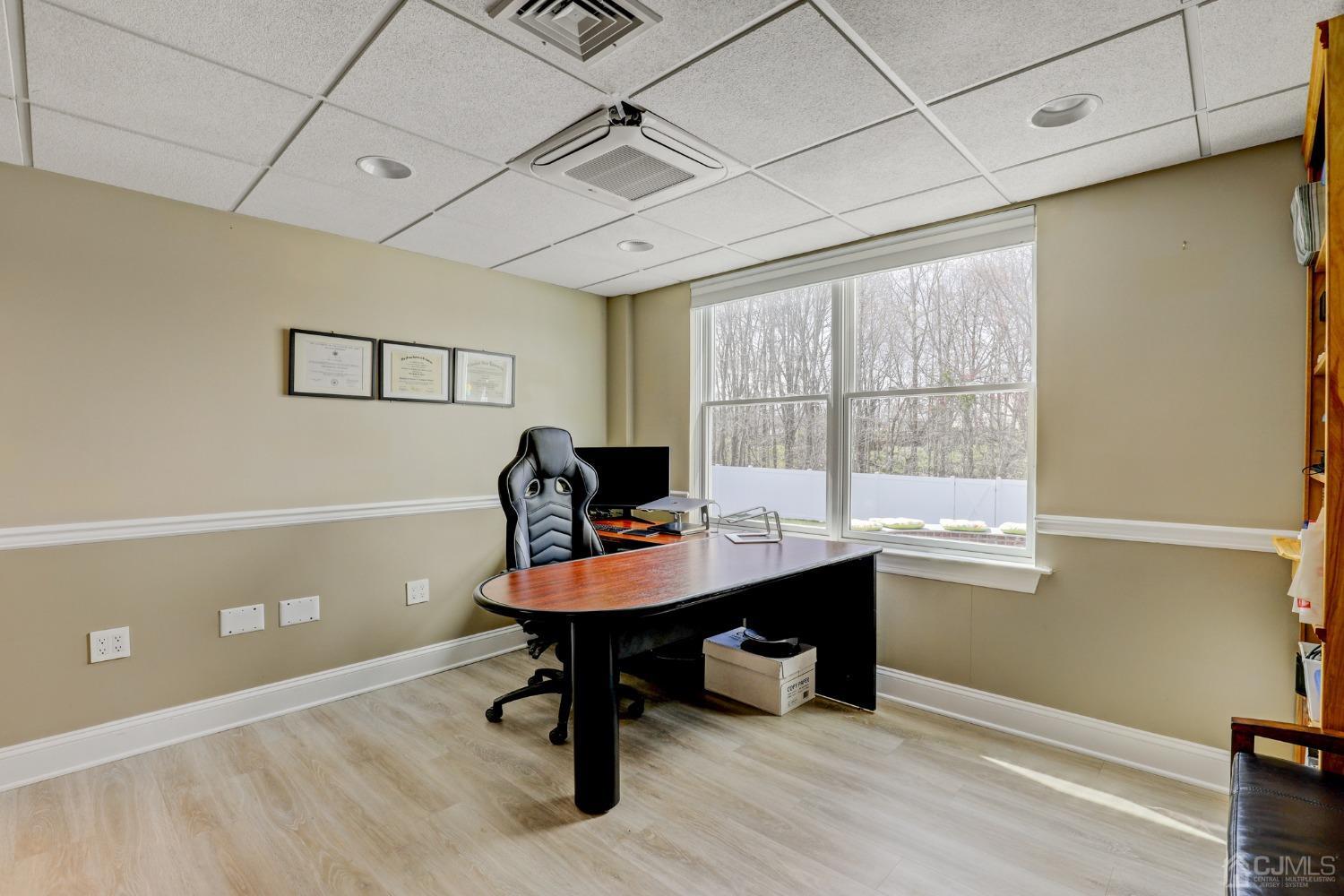 33 Edinburg Circle Old Bridge, NJ 07747 - Photo 35 of 51 a view of a workspace with furniture and a window