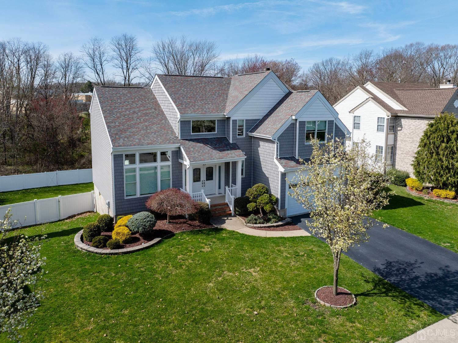 33 Edinburg Circle Old Bridge, NJ 07747 - Photo 4 of 51 a front view of a house with a yard table and chairs