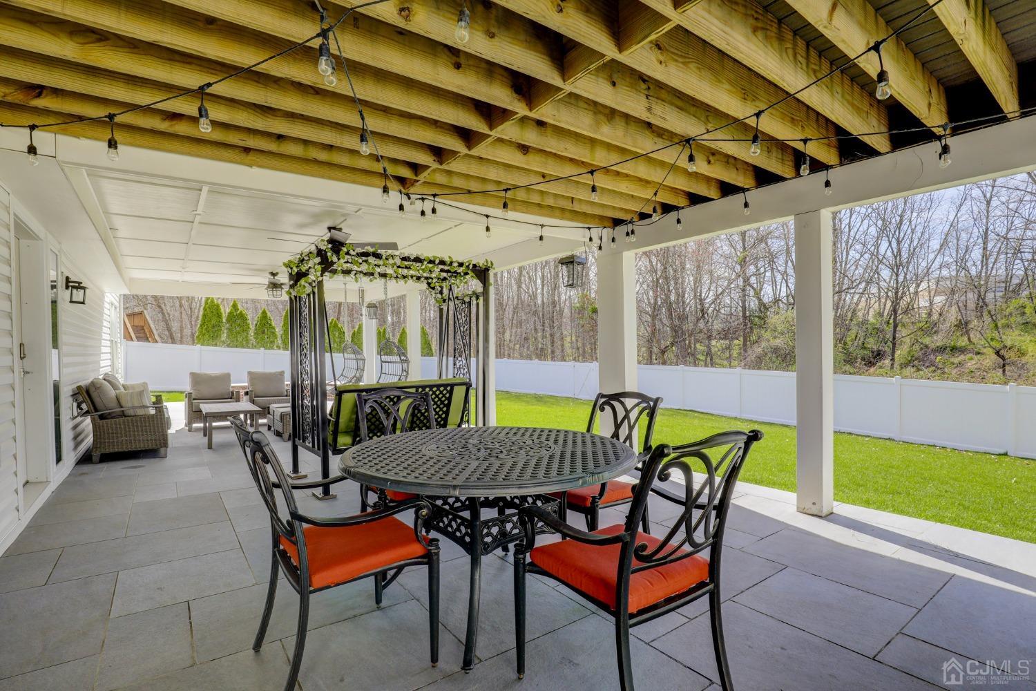 33 Edinburg Circle Old Bridge, NJ 07747 - Photo 43 of 51 a view of a patio with a table and chairs