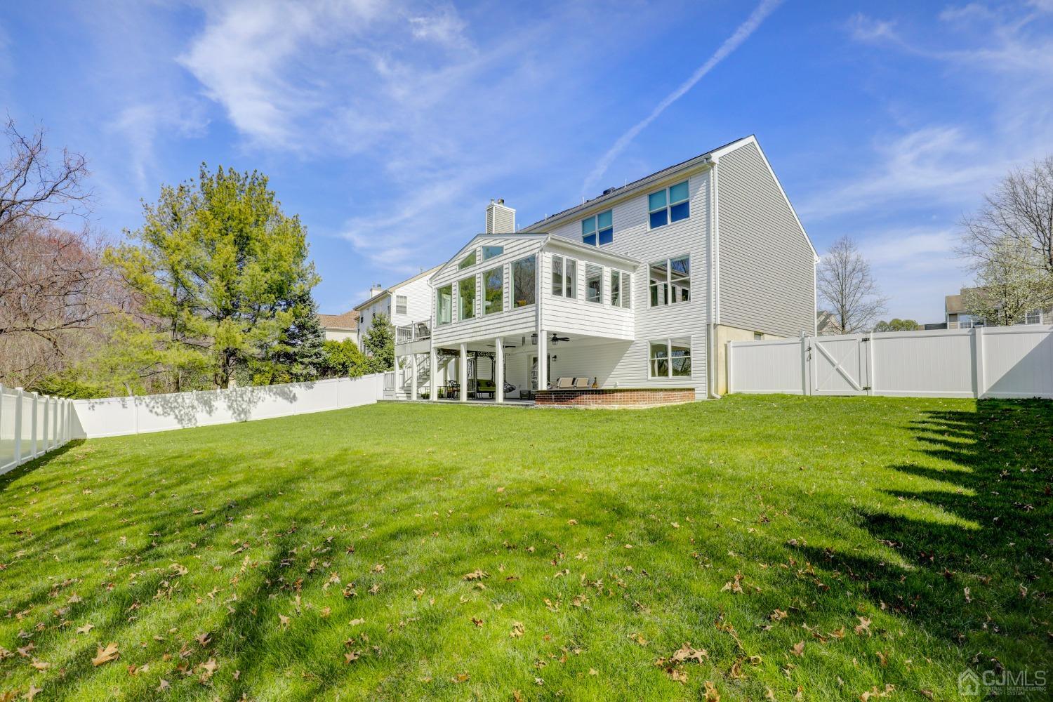 33 Edinburg Circle Old Bridge, NJ 07747 - Photo 45 of 51 a view of a house with a big yard and large trees