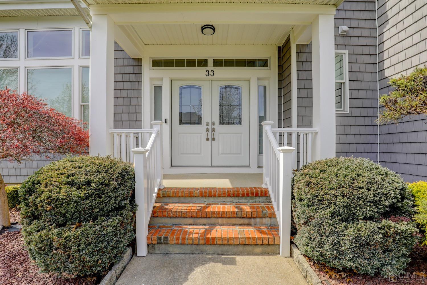 33 Edinburg Circle Old Bridge, NJ 07747 - Photo 7 of 51 a front view of a house with a garden