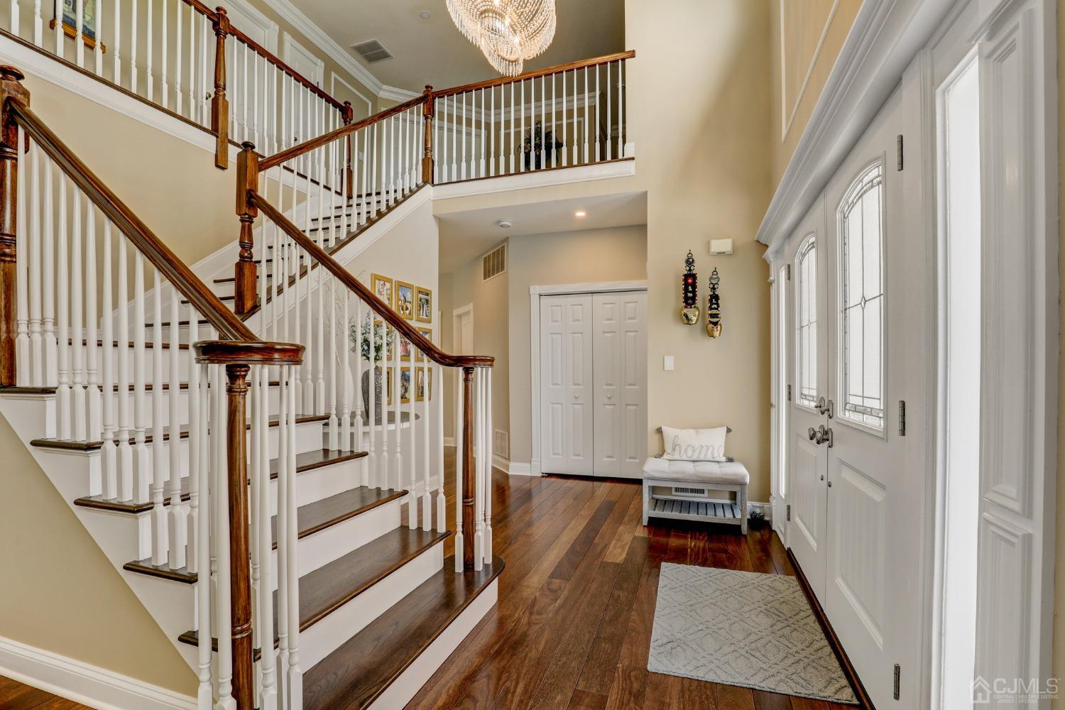 33 Edinburg Circle Old Bridge, NJ 07747 - Photo 8 of 51 a view of a hallway with wooden floor and staircase