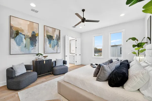 a bedroom with a bed couch and window