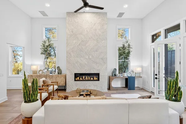 a living room with furniture and flowers