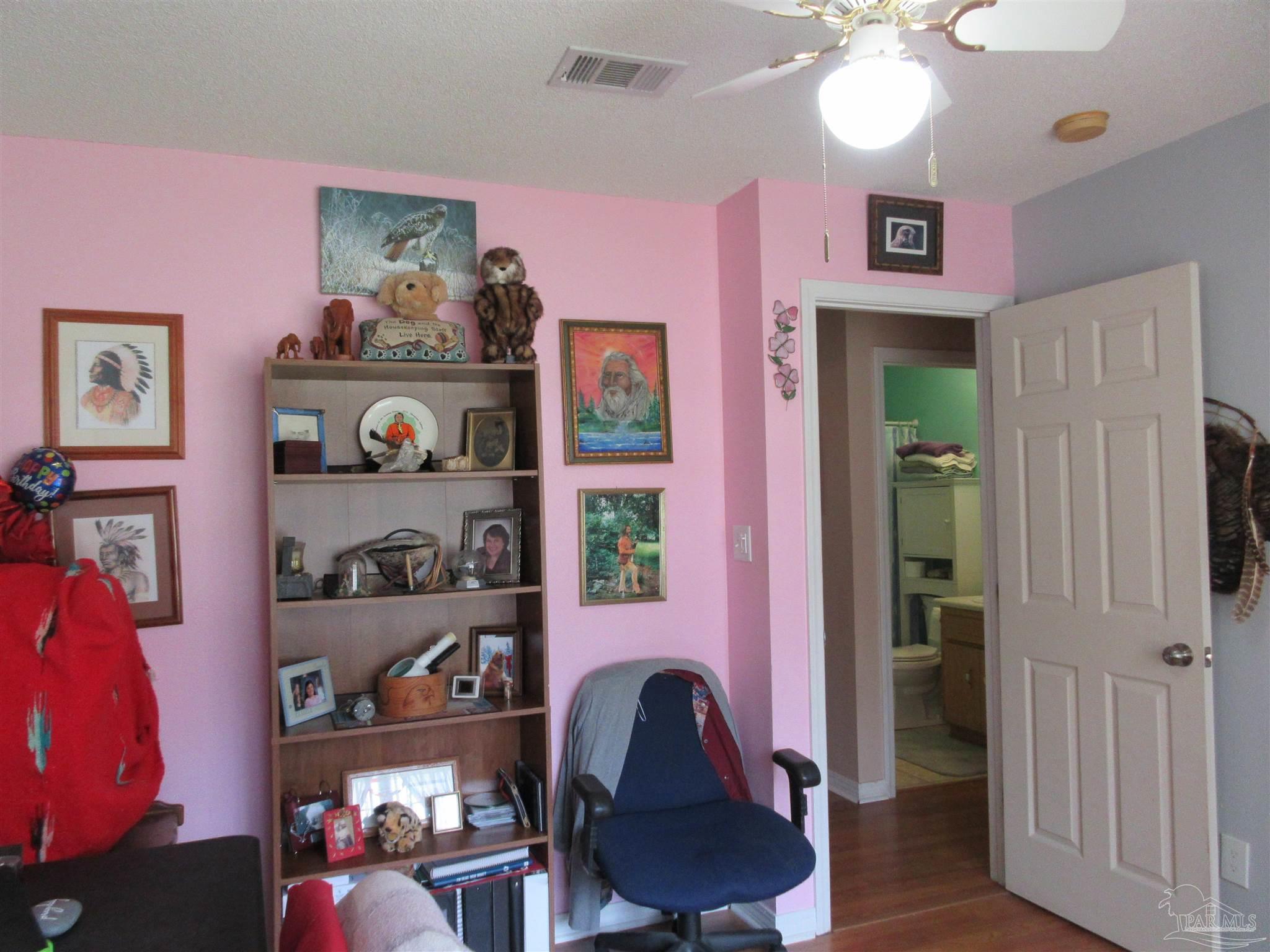 4523 Struth Lane Pace, FL 32571 - Photo 33 of 49 a workspace room with furniture and wooden floor